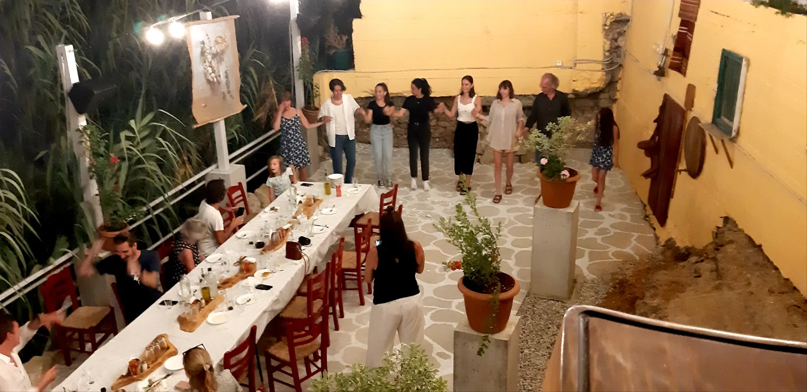The 15.3-metre table laid with white cloths down a narrow courtyard